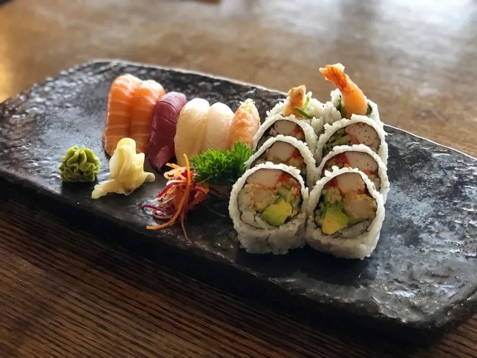 Sushi Lunch C: assorted nigiri with dynamite maki on a stone plate